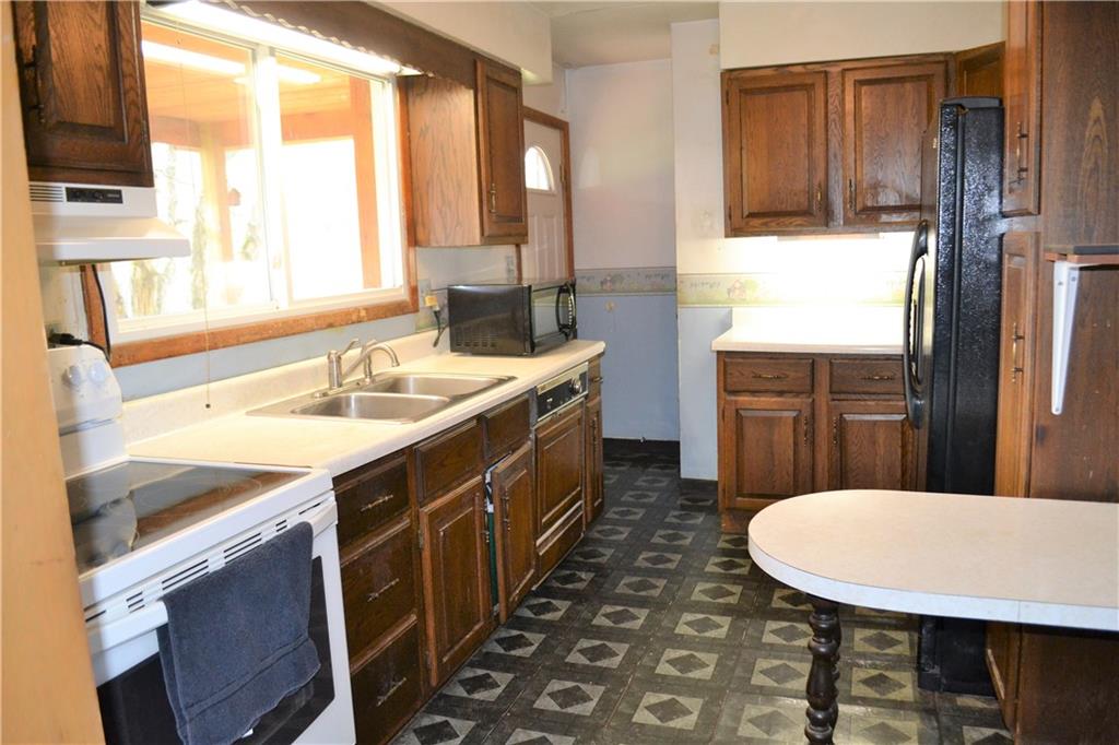 1220 State Rte 28 And 66 Templeton, PA 16259 - Photo 6 of 24 a kitchen with a sink and a refrigerator