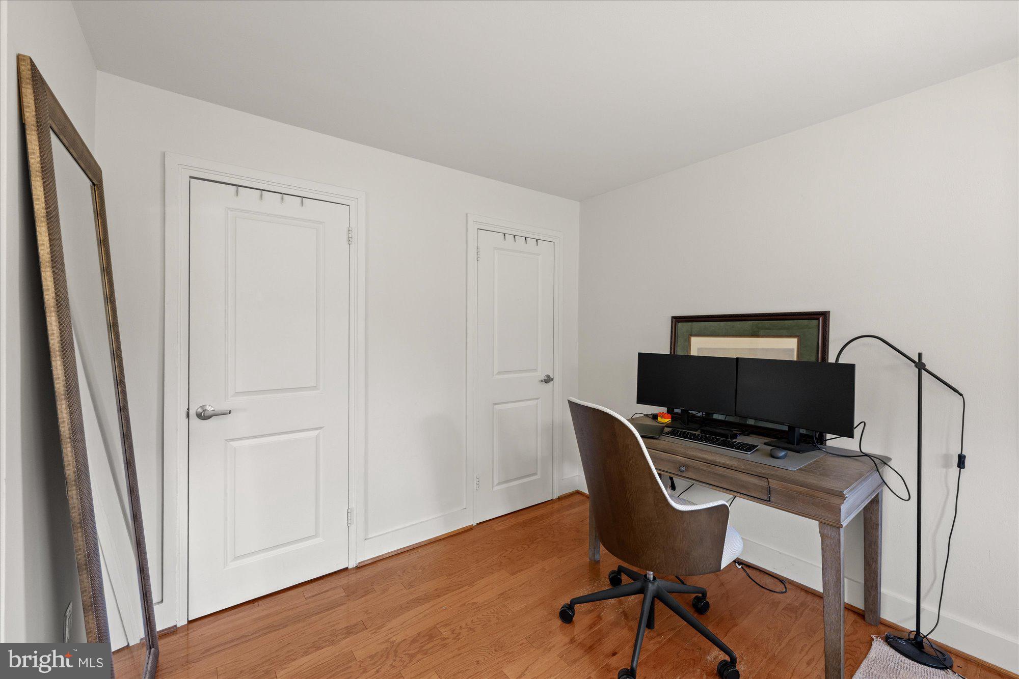 4840 MacArthur Boulevard Northwest, Unit 301 Washington, DC 20007 - Photo 17 of 24 a view of a workspace with furniture and wooden floor