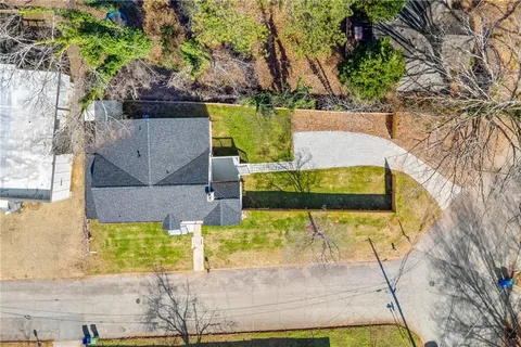 an aerial view of a house with swimming pool