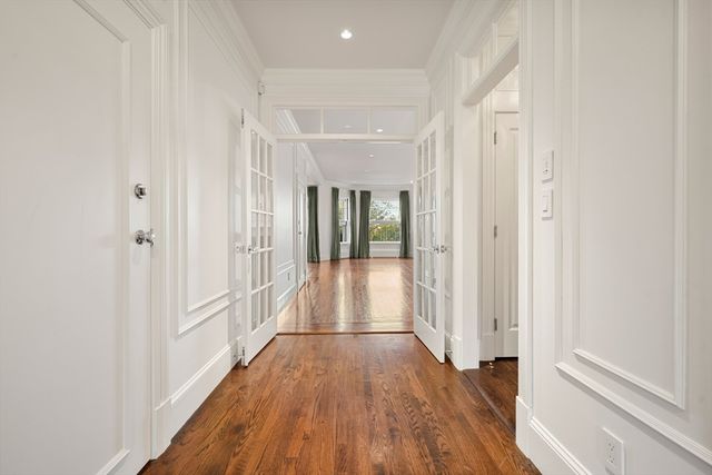 a view of gallery with wooden floor