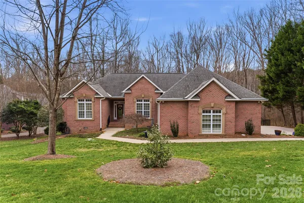 a front view of house with yard and green space