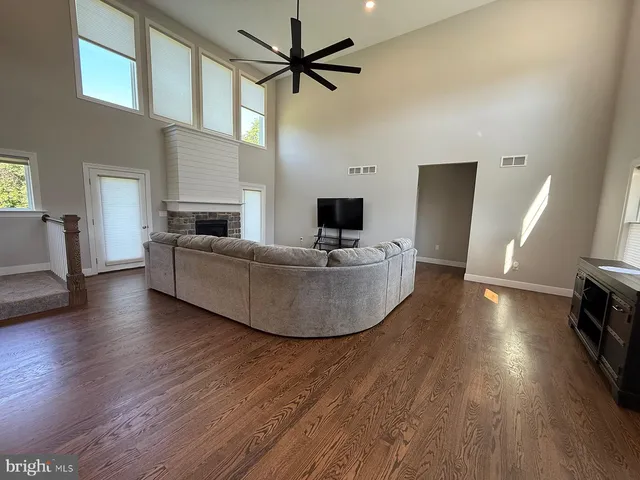a view of a livingroom with furniture and a flat screen tv