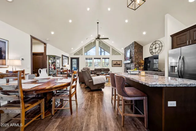a large kitchen with a table and chairs