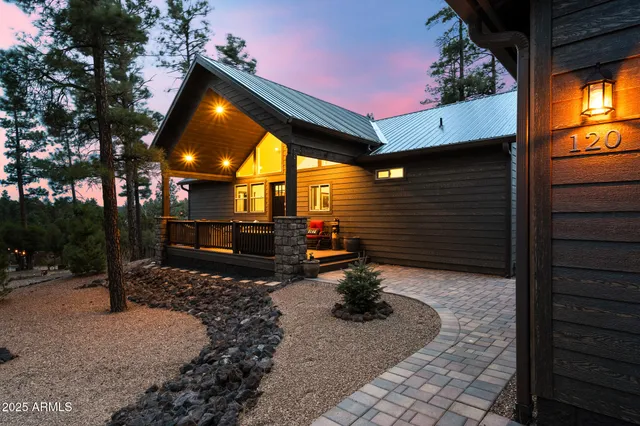 a view of swimming pool with chairs and fire pit