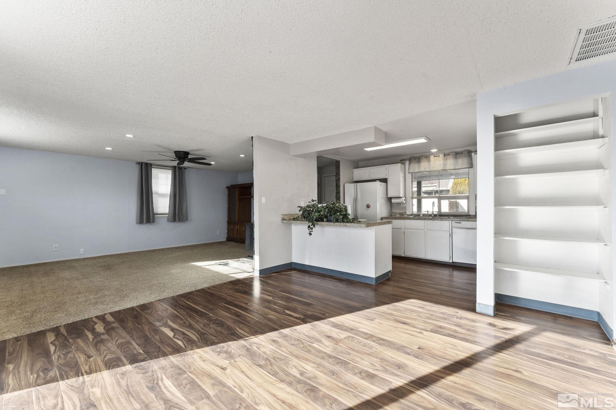 3810 Snipe Drive Reno, NV 89508 - Photo 1 of 38 a living room with furniture and wooden floor