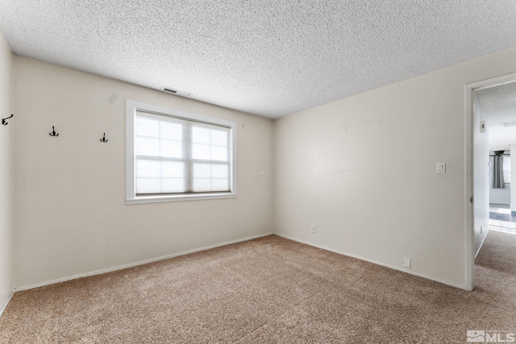 3810 Snipe Drive Reno, NV 89508 - Photo 16 of 38 an empty room with a window
