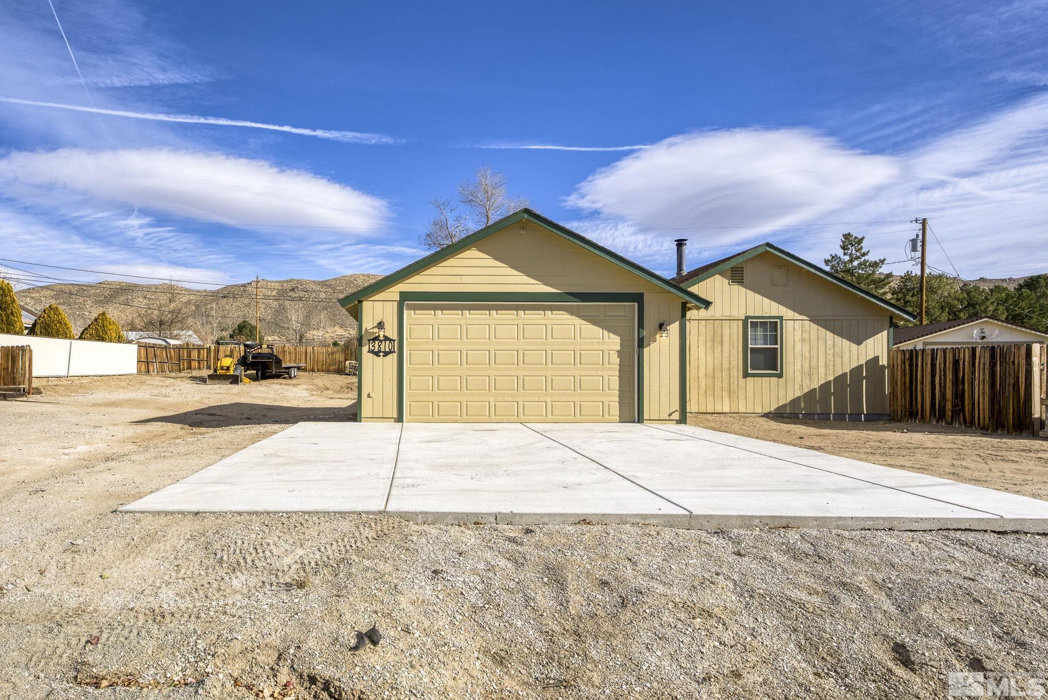 3810 Snipe Drive Reno, NV 89508 - Photo 27 of 38 a view of yellow house with a yard