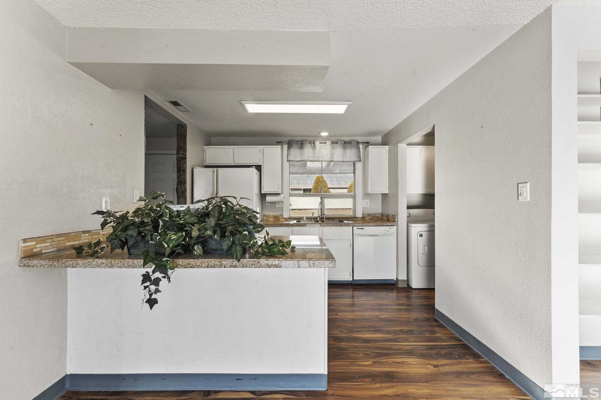 3810 Snipe Drive Reno, NV 89508 - Photo 7 of 38 a view of kitchen with cabinets and wooden floor