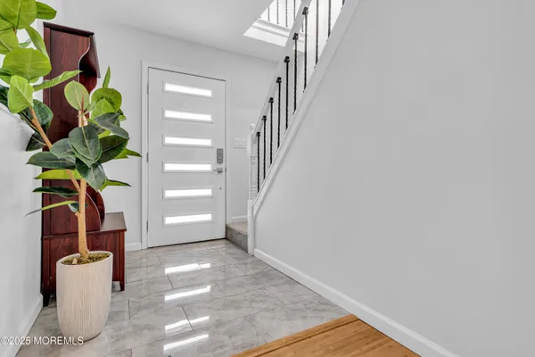 a view of entryway with wooden floor