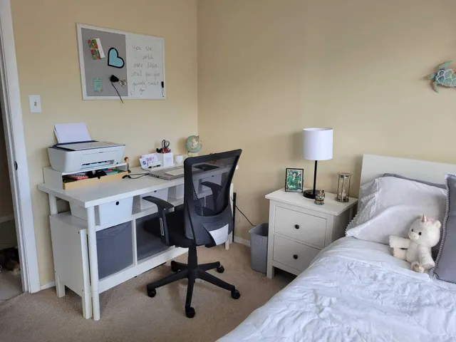 a view of a workspace with furniture