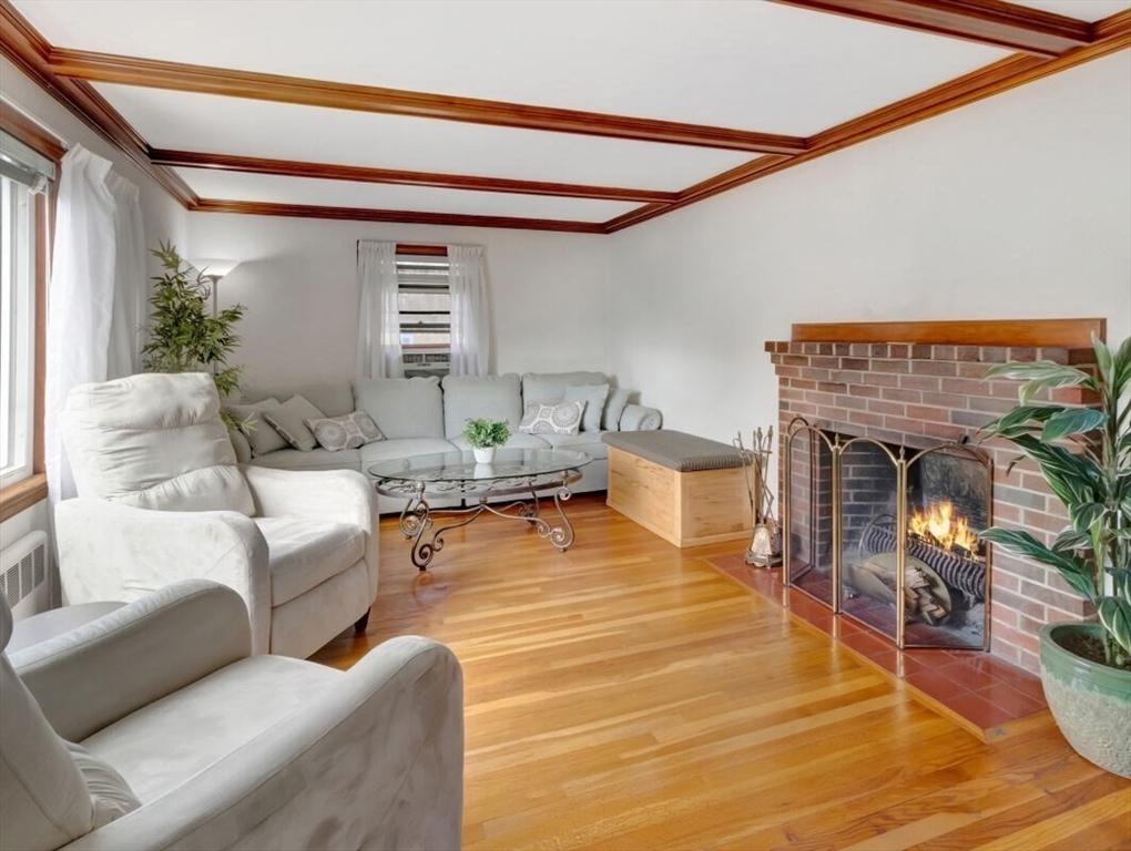 222 Walnut Street Saugus, MA 01906 - Photo 11 of 42 a living room with furniture and a fireplace