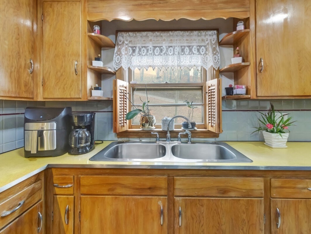 222 Walnut Street Saugus, MA 01906 - Photo 15 of 42 a kitchen with a sink and cabinets