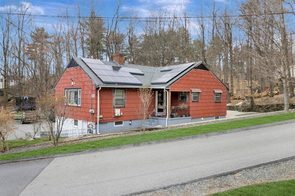 222 Walnut Street Saugus, MA 01906 - Photo 2 of 42 a front view of a house with a yard and garage