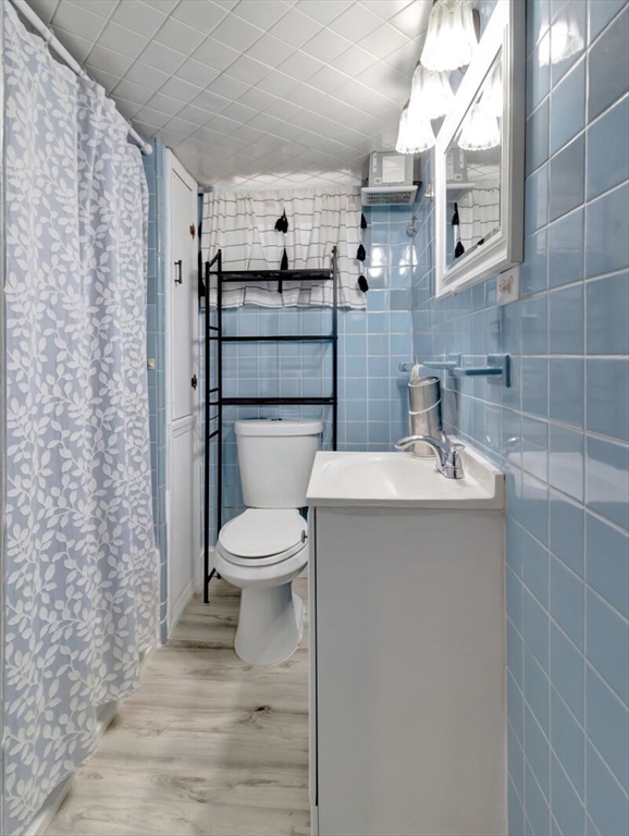 222 Walnut Street Saugus, MA 01906 - Photo 27 of 42 a bathroom with a toilet sink and mirror