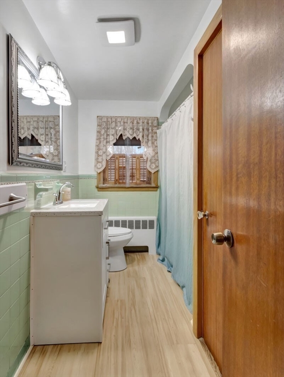 222 Walnut Street Saugus, MA 01906 - Photo 29 of 42 a room with a sink a window and a mirror