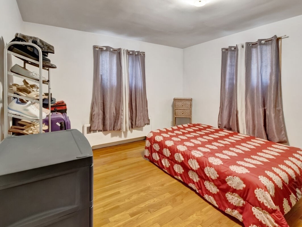 222 Walnut Street Saugus, MA 01906 - Photo 30 of 42 a bedroom with a bed and a dresser