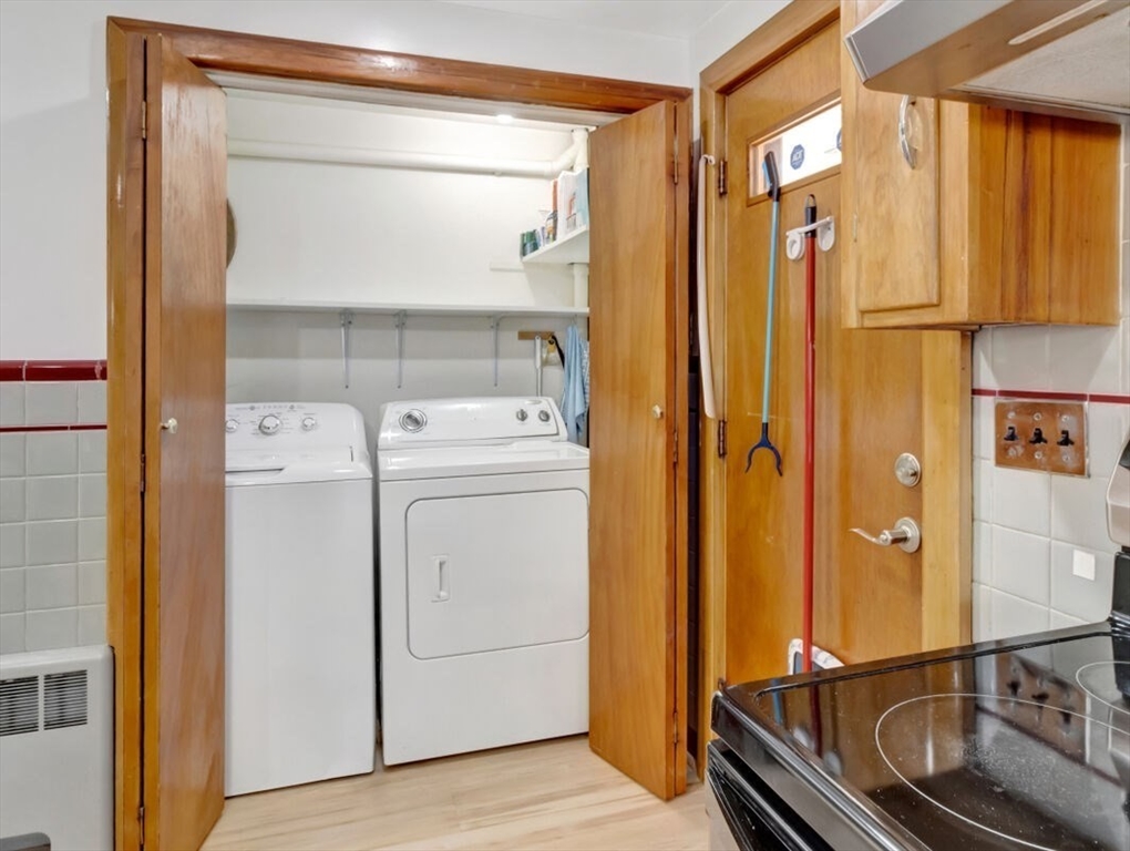 222 Walnut Street Saugus, MA 01906 - Photo 31 of 42 a view of washer and dryer with wooden floor