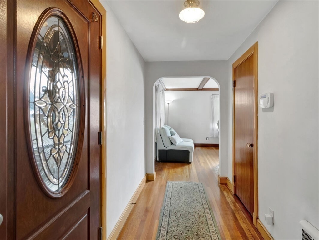 222 Walnut Street Saugus, MA 01906 - Photo 7 of 42 a view of a livingroom with furniture and mirror