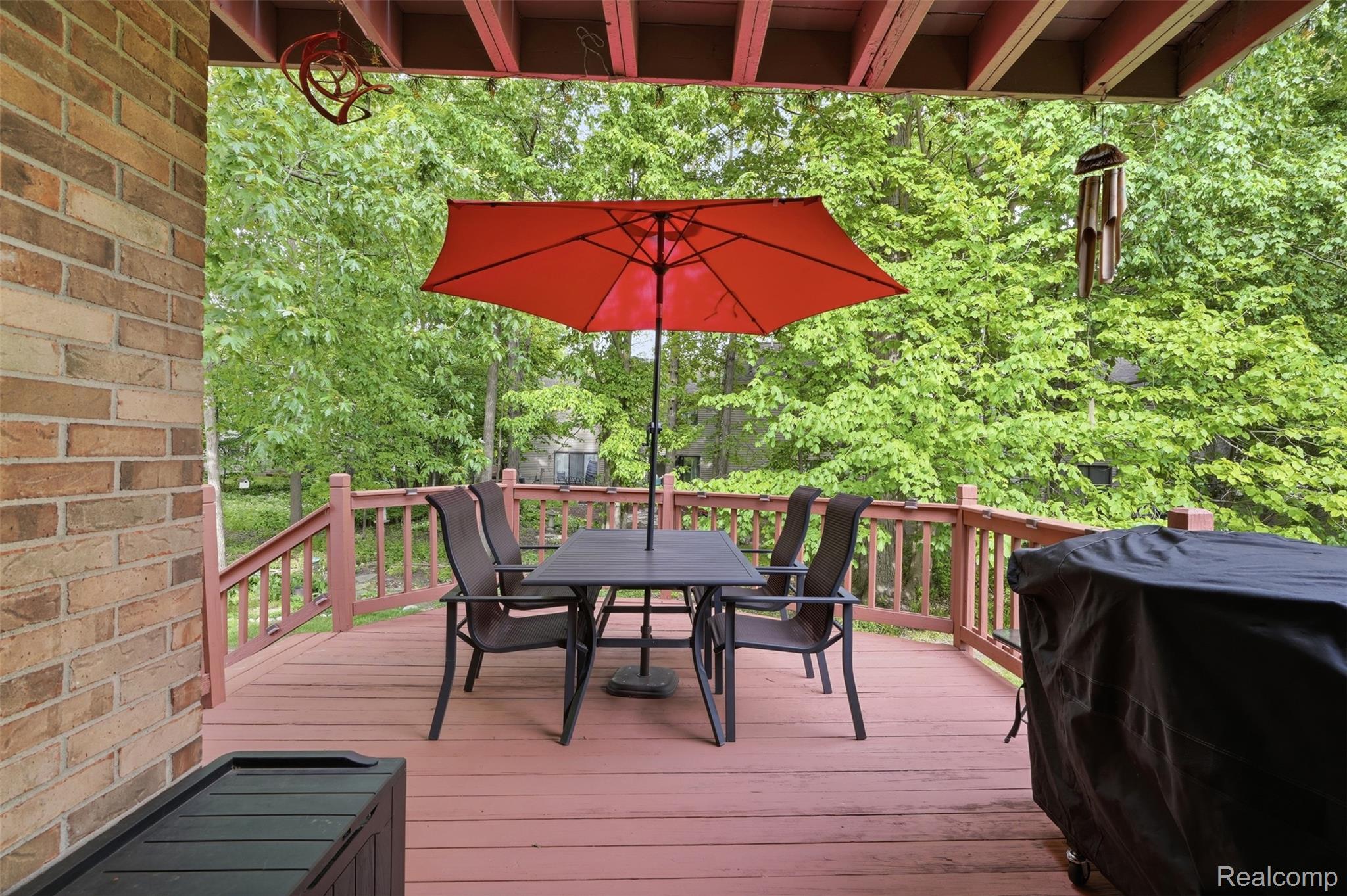 1687 Lodge Pole Lane Rochester, MI 48309 - Photo 28 of 53 Expansive outdoor deck featuring wood-finish flooring, a full-height railing, and open-air design