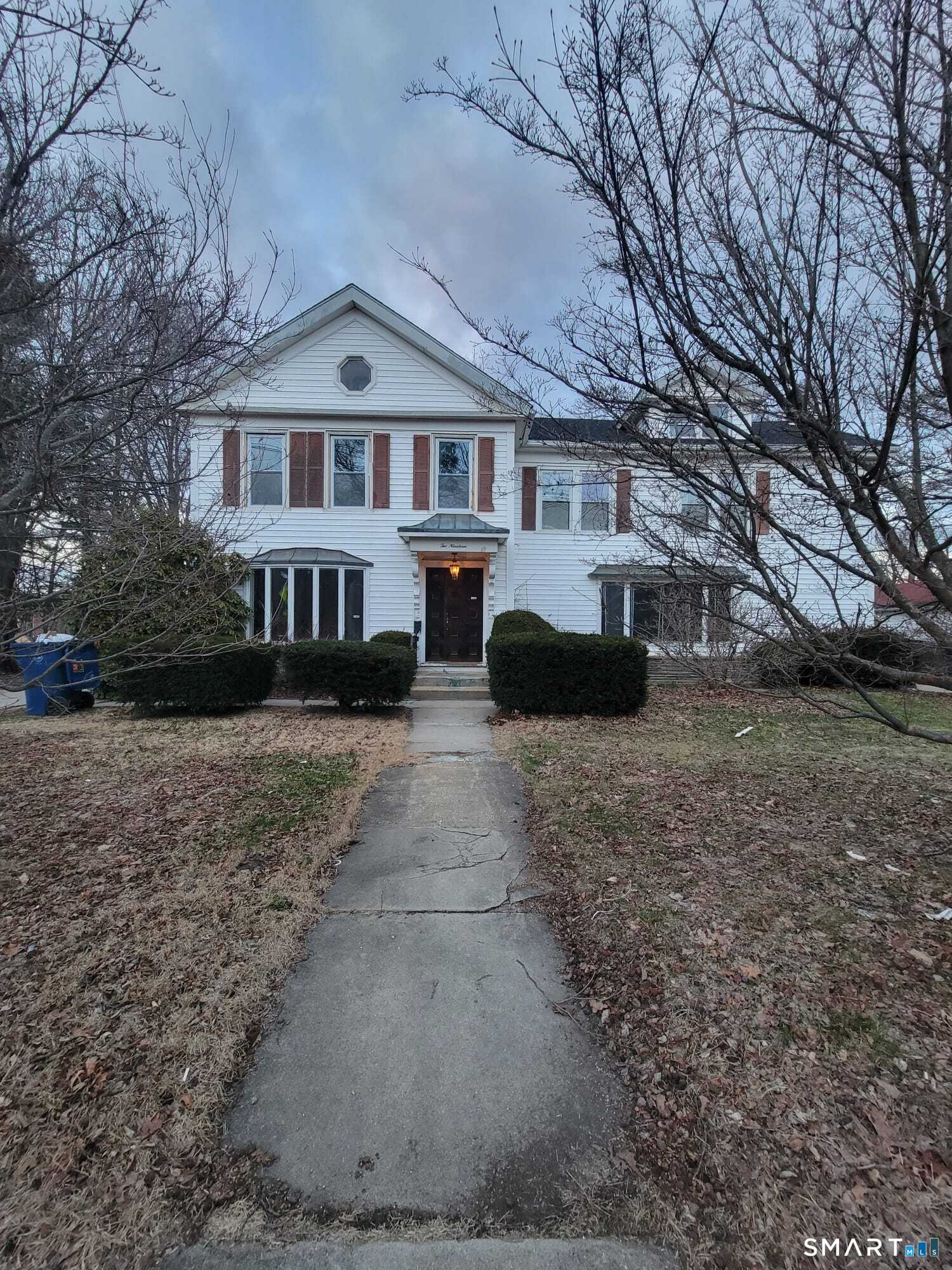 a front view of a house with a yard