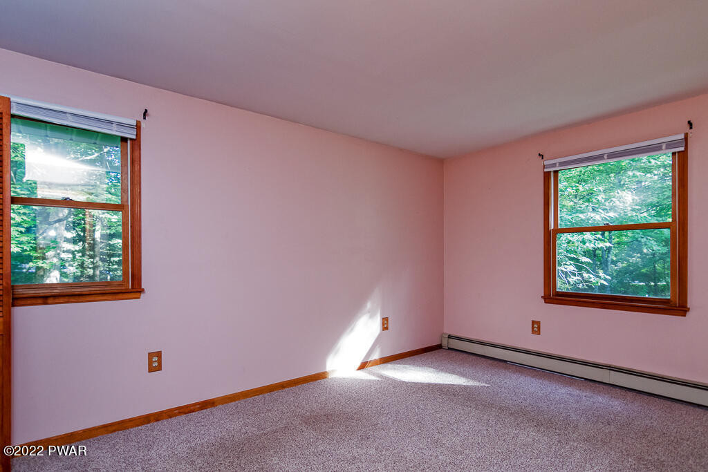 166 Devils Hole Road Cresco, PA 18326 - Photo 19 of 46 an empty room with windows