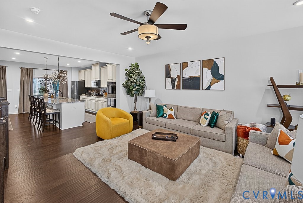 17976 Spotted Oak Road Dumfries, VA 22026 - Photo 18 of 52 Open-concept living space featuring wood-finish fl