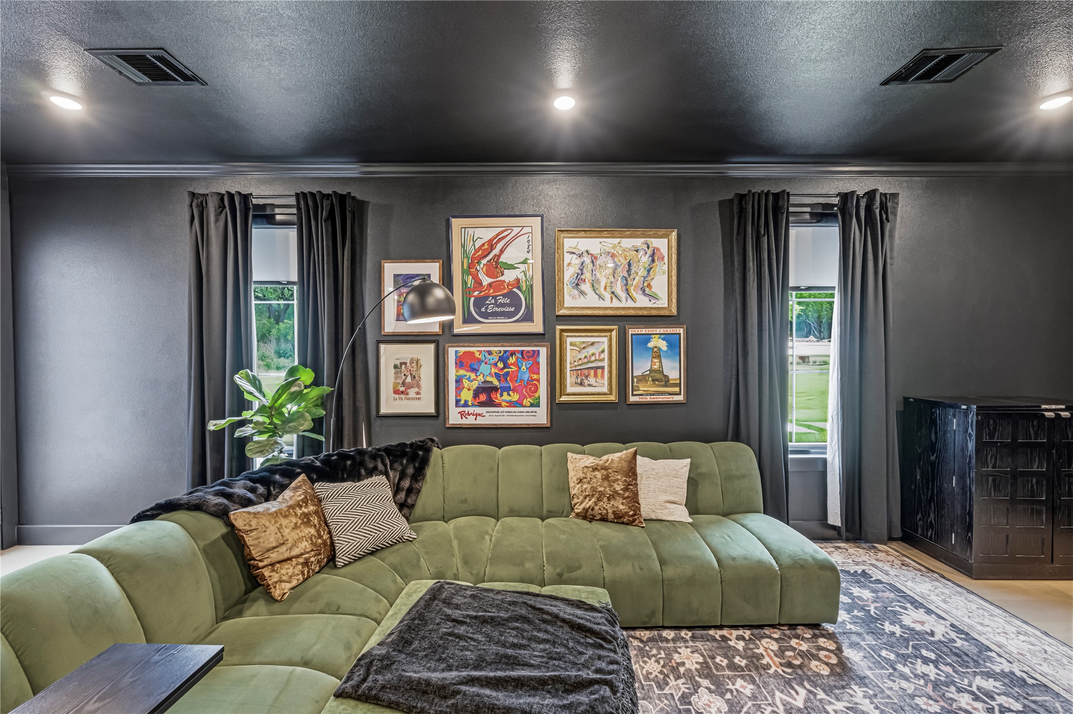 14302 Fallen Timber Drive Austin, TX 78734 - Photo 19 of 37 Living area featuring dark walls, recessed lighting, and a window with dark curtains