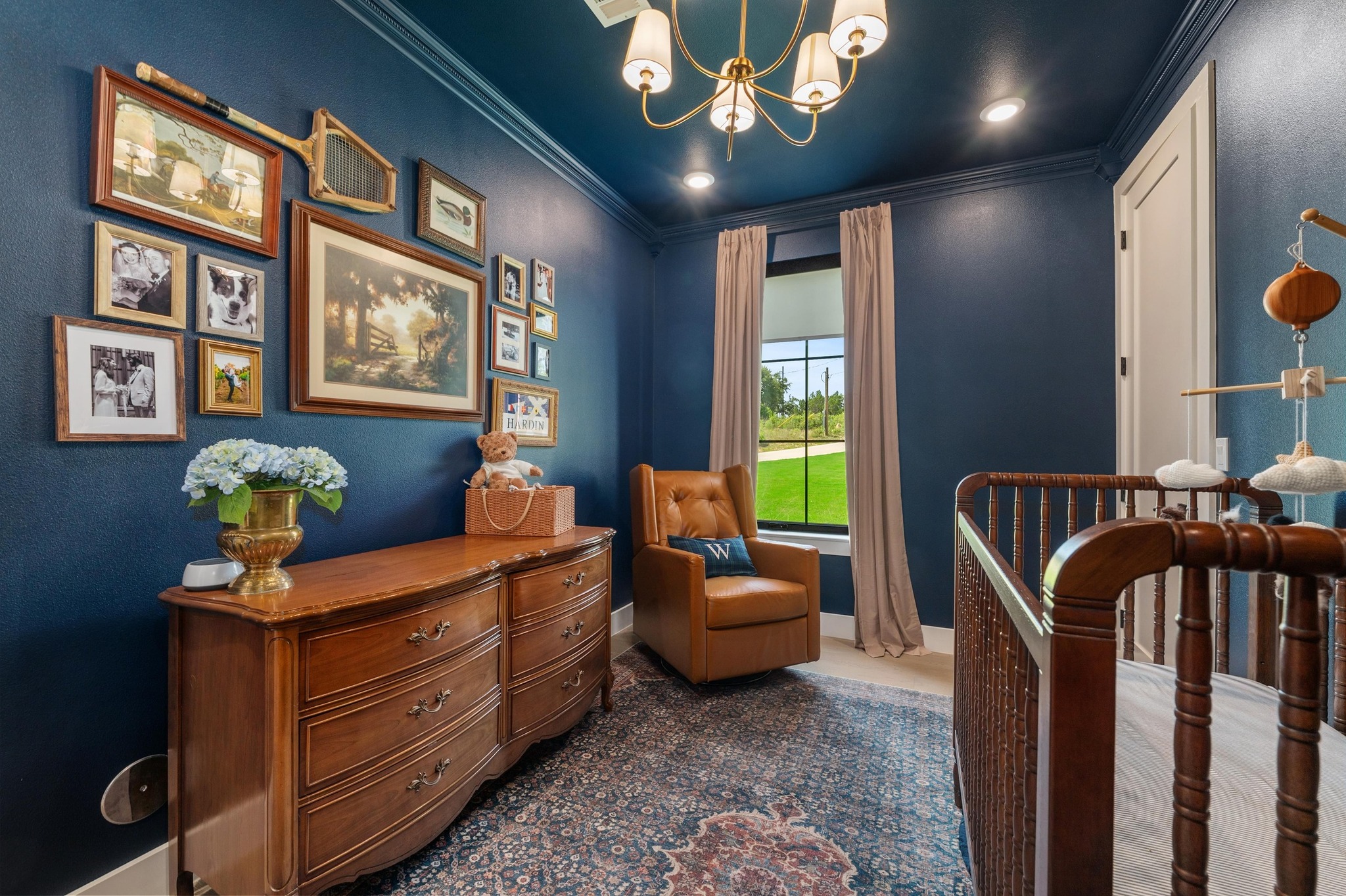 14302 Fallen Timber Drive Austin, TX 78734 - Photo 22 of 37 This room features deep blue walls and ceiling, a window with a view of a green lawn, and a light-colored door