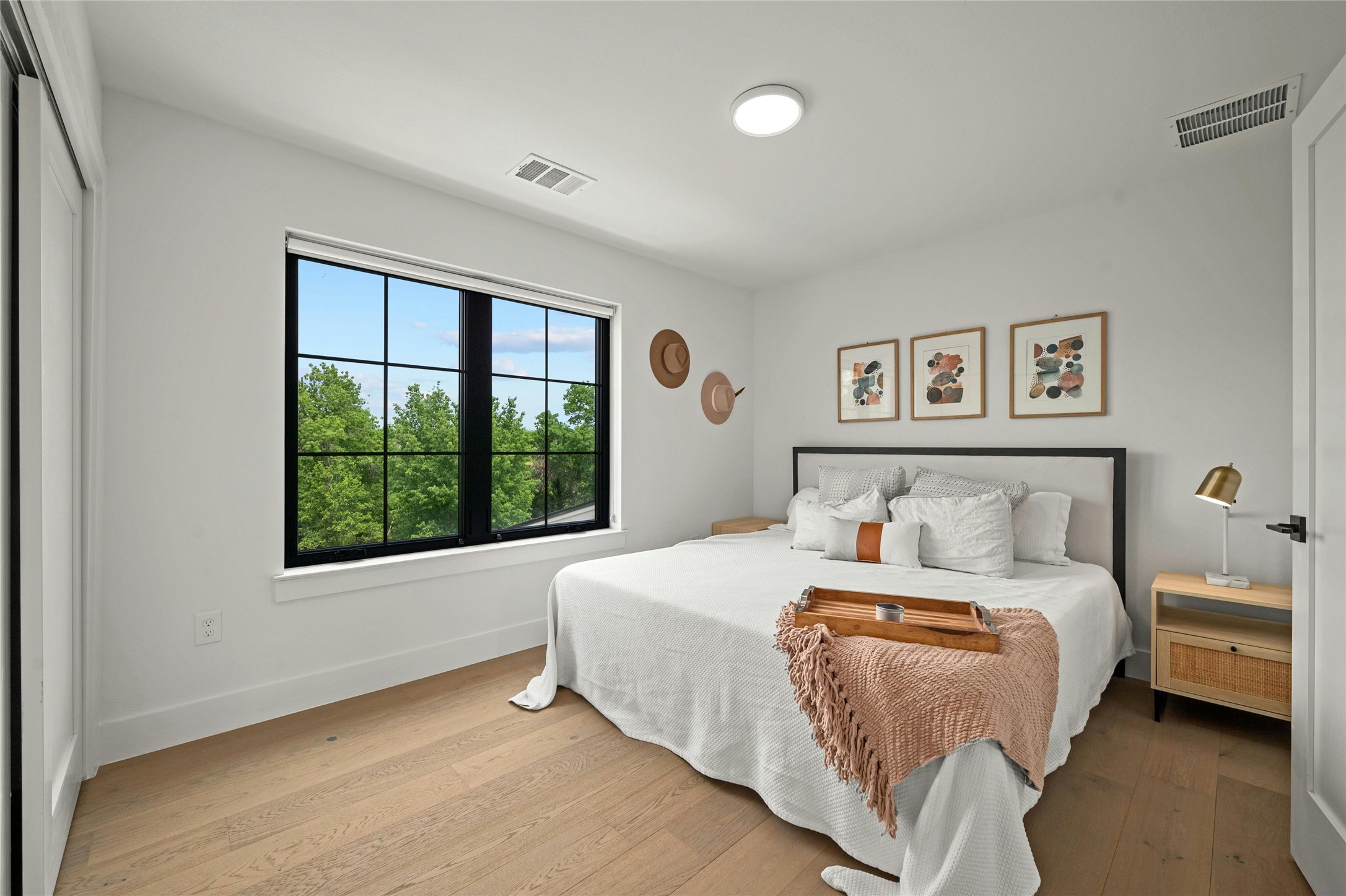 14302 Fallen Timber Drive Austin, TX 78734 - Photo 24 of 37 This room features light-colored hardwood flooring and white walls, creating a bright and airy atmosphere