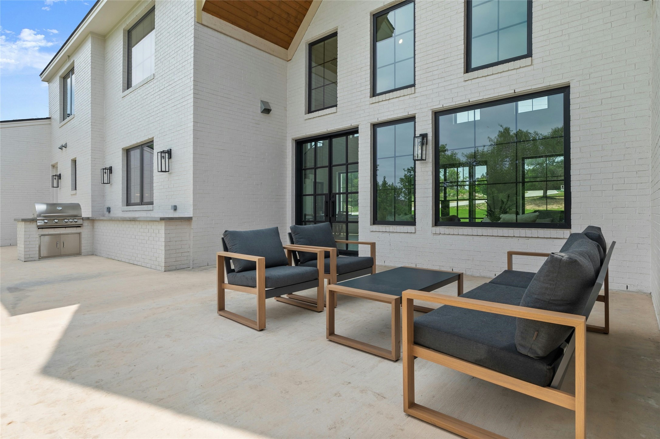 14302 Fallen Timber Drive Austin, TX 78734 - Photo 29 of 37 The property features a spacious outdoor patio area with a built-in grill and counter space