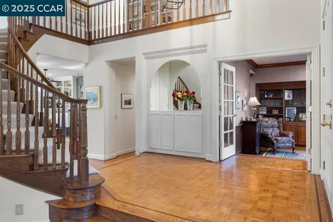 a spacious bedroom with a bed and a fireplace