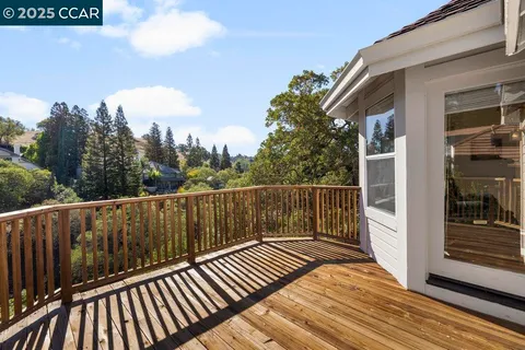 a bathroom with a tub and a large window