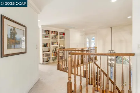 a view of hallway with livingroom and furniture