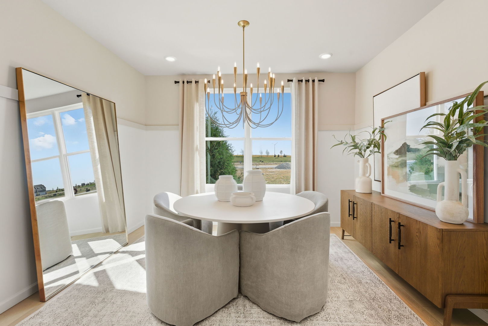 660 Redtop Way Bolingbrook, IL 60490 - Photo 14 of 22 a dining table with large mirror and kitchen view
