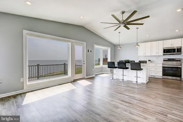 a view of kitchen with furniture and wooden floor