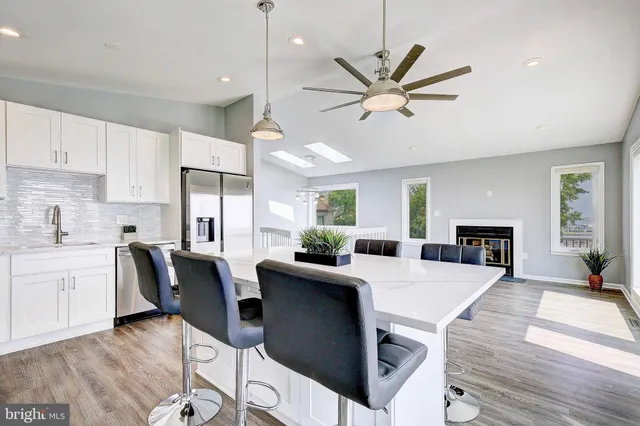 a view of kitchen with cabinets and wooden floor