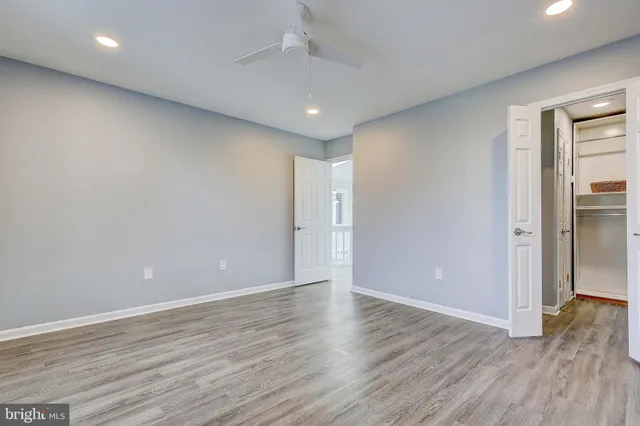 a view of room with wooden floor