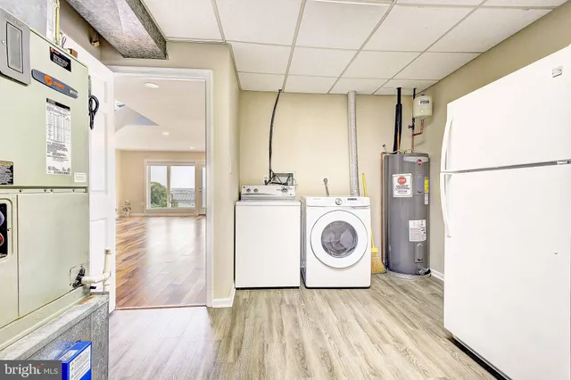 a bathroom with a granite countertop sink a toilet and bathtub
