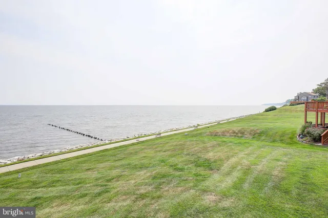 a view of a balcony with wooden floor