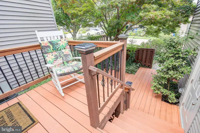 a tree in front of a white house