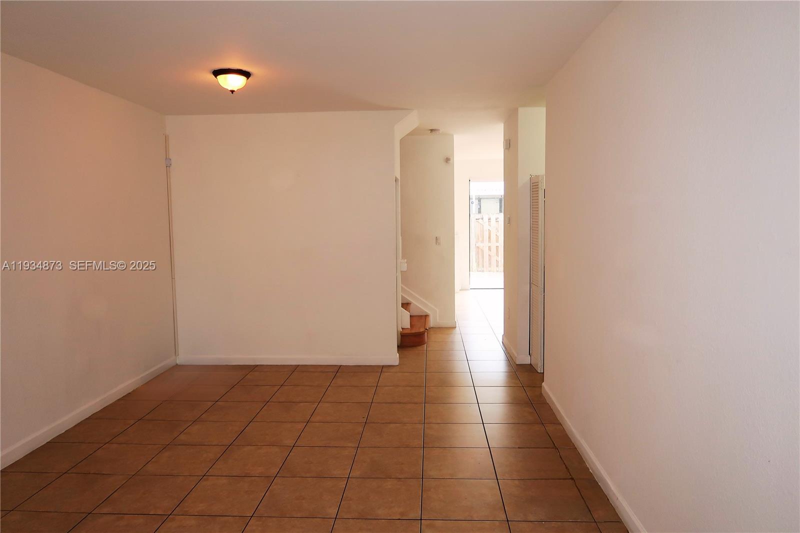 11334 Southwest 236th Street, Unit 11334 Homestead, FL 33032 - Photo 2 of 25 a view of an empty room and window