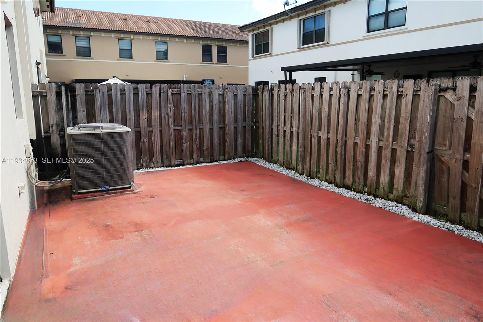 11334 Southwest 236th Street, Unit 11334 Homestead, FL 33032 - Photo 6 of 25 a view of an empty room with wooden fence