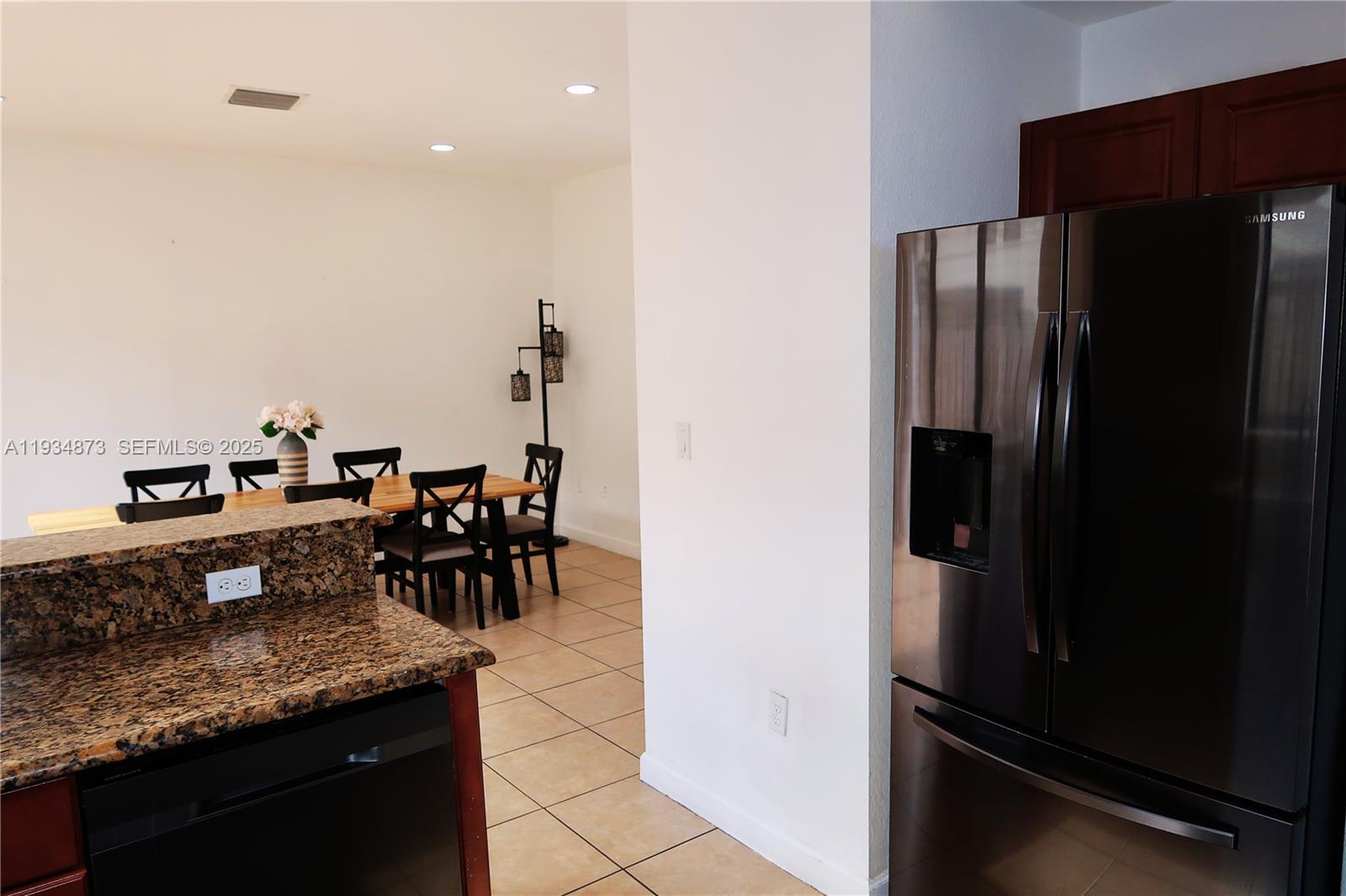 11334 Southwest 236th Street, Unit 11334 Homestead, FL 33032 - Photo 9 of 25 a kitchen with counter top space and stainless steel appliances
