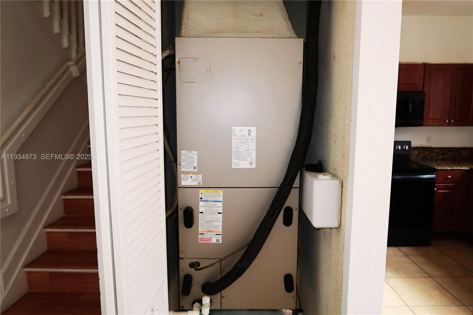 11334 Southwest 236th Street, Unit 11334 Homestead, FL 33032 - Photo 10 of 25 a view of entryway and kitchen