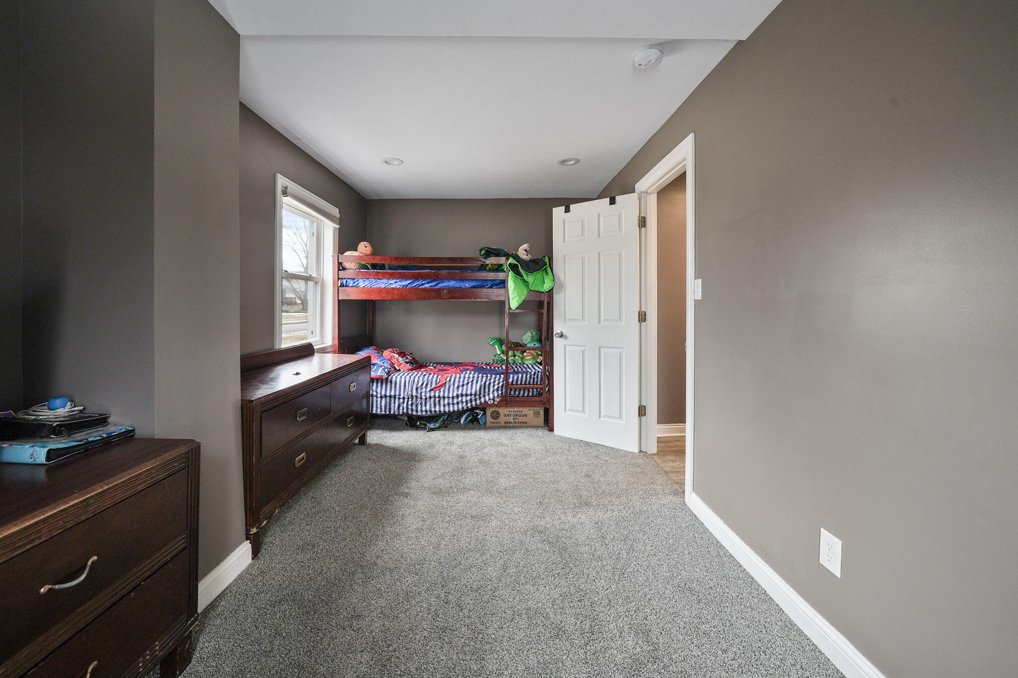 345 Castle Street Lowell, IN 46356 - Photo 14 of 27 a bedroom with a bed and a window