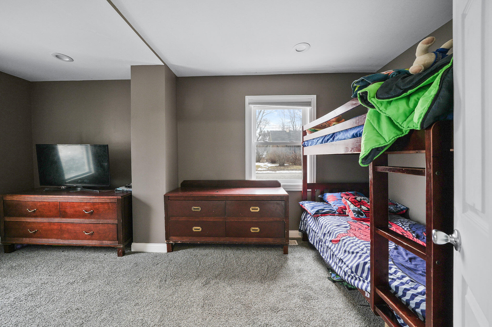 345 Castle Street Lowell, IN 46356 - Photo 15 of 27 a bedroom with a bed and a window