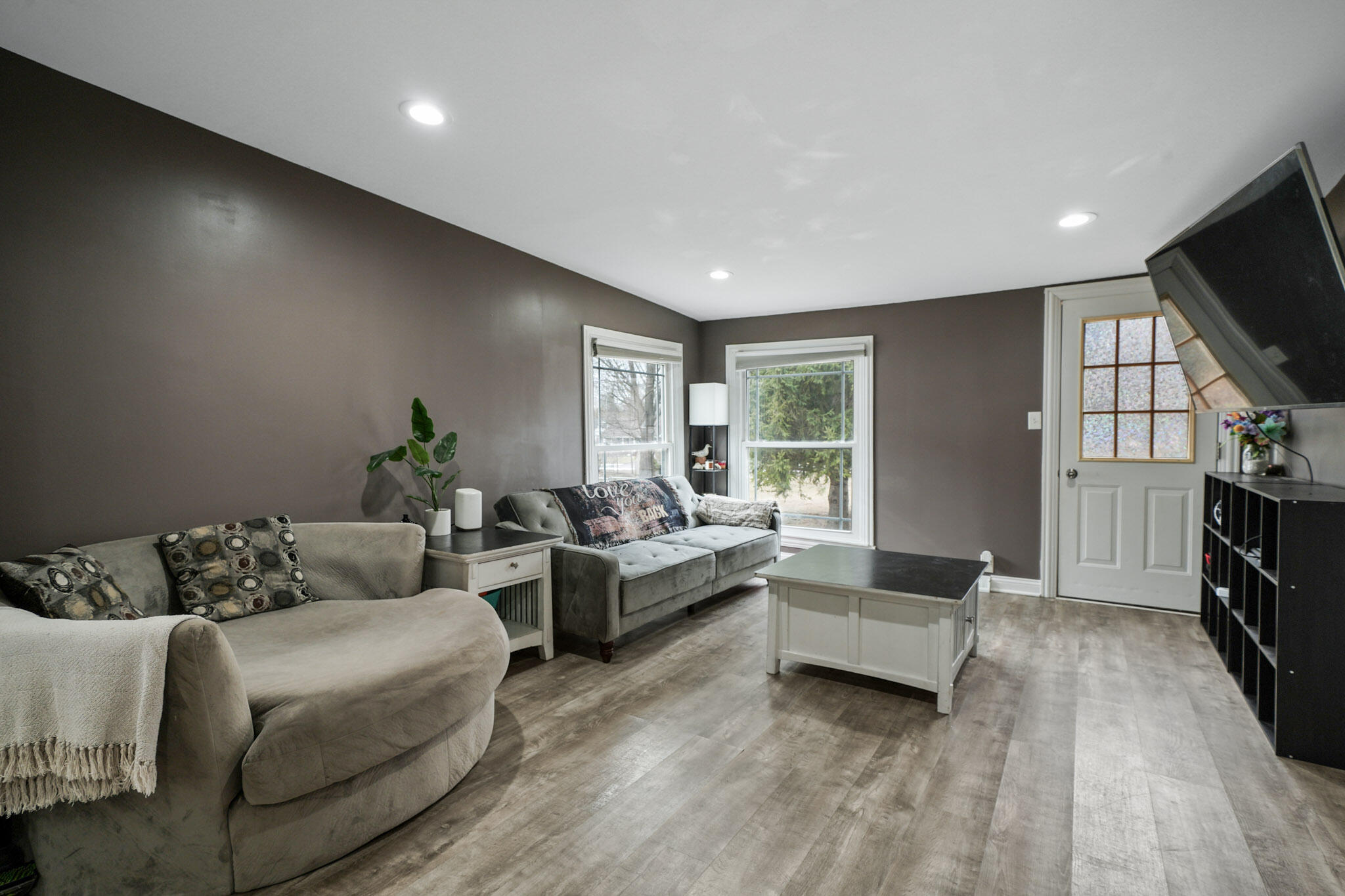 345 Castle Street Lowell, IN 46356 - Photo 23 of 27 a living room with furniture and a flat screen tv