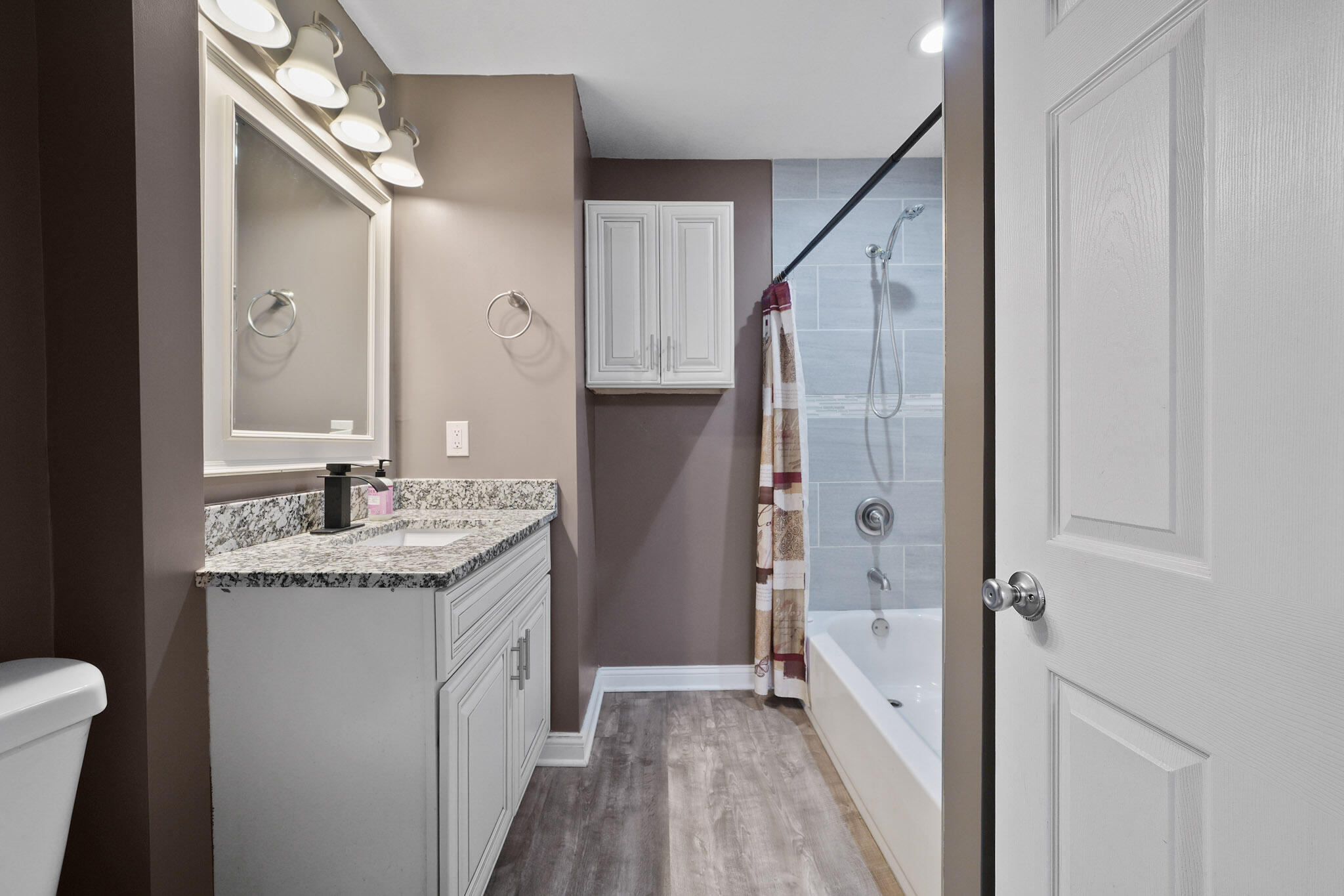 345 Castle Street Lowell, IN 46356 - Photo 25 of 27 a bathroom with a granite countertop sink a toilet and shower