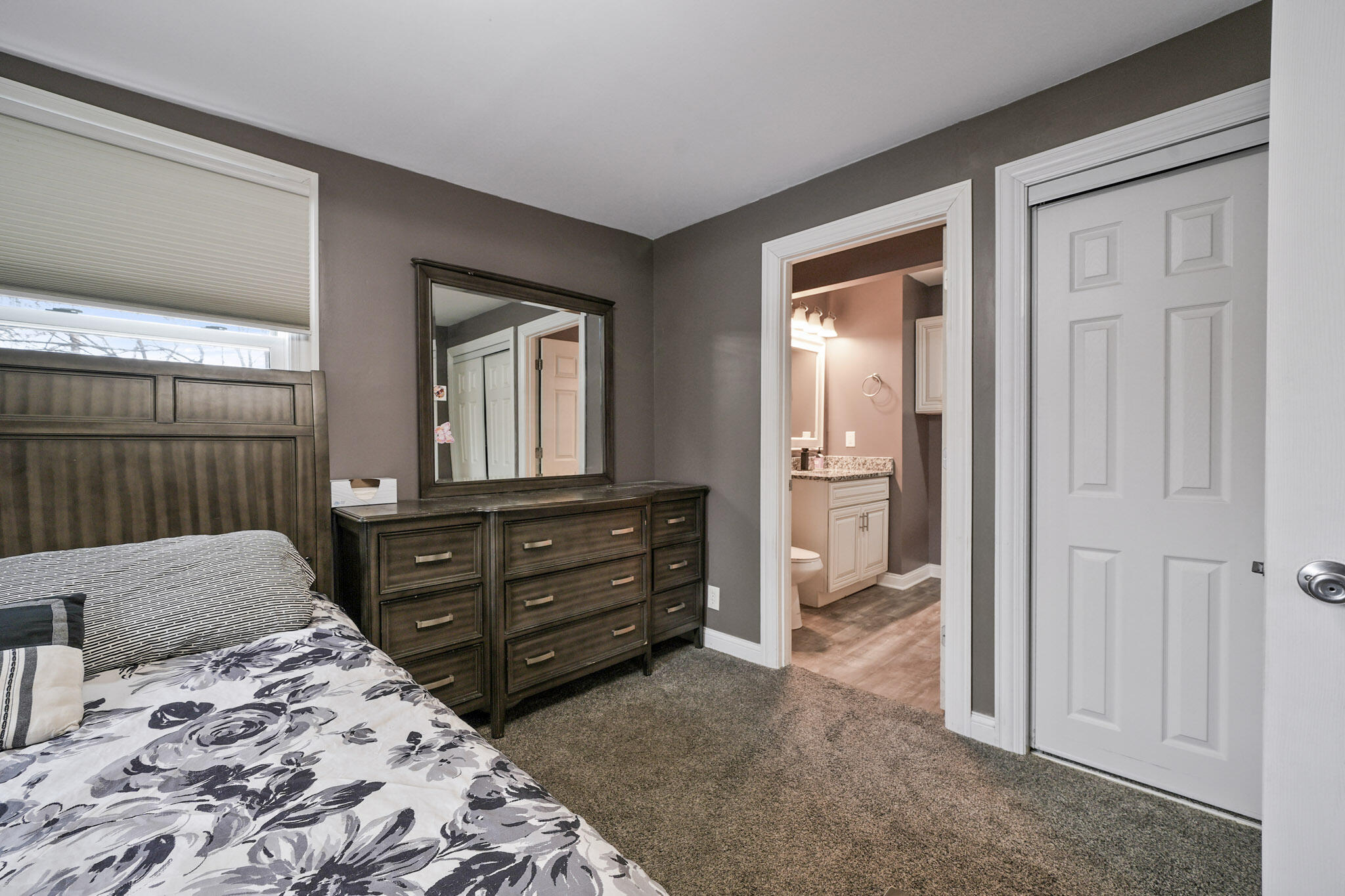 345 Castle Street Lowell, IN 46356 - Photo 26 of 27 a bedroom with a bed and a dresser