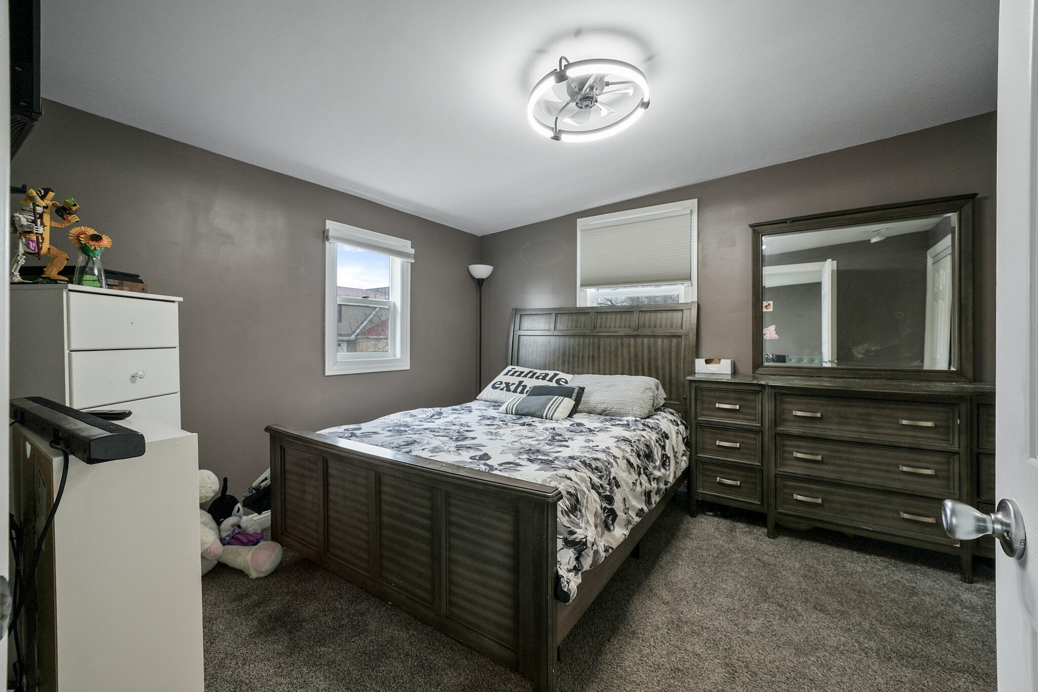 345 Castle Street Lowell, IN 46356 - Photo 27 of 27 a bedroom with a bed and a dresser